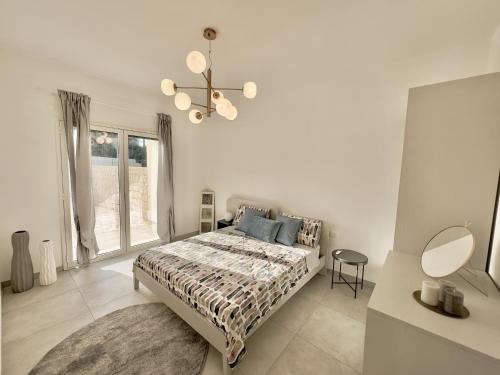 a bedroom with a bed and a large window at Dimora Mediterranea in Augusta
