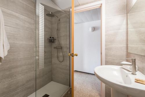 a bathroom with a shower and a sink at Hotel Cartago Nova by ALEGRIA in Malgrat de Mar
