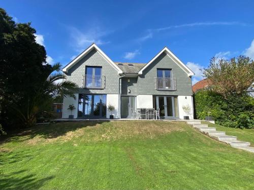 a large house with a lawn in front of it at No.10 Falmouth - 2 minutes walk to the beach in Falmouth