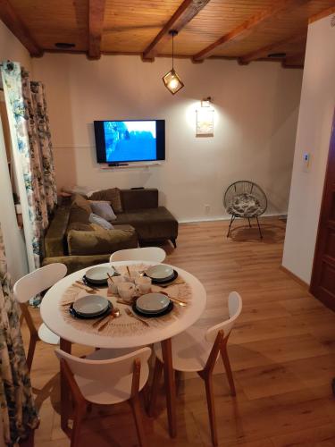 a living room with a table and chairs and a couch at Apartament w Centrum in Żuromin