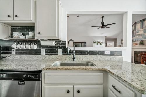 a kitchen with a sink and a counter top at PCB Beach House minutes from fun! in Panama City Beach