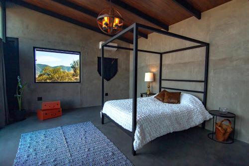 Voodi või voodid majutusasutuse Prajna Valle de Guadalupe toas