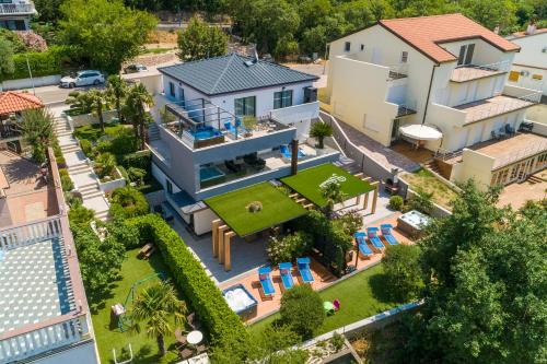 an aerial view of a house with a pool at Relax Derossi 2 in Crikvenica