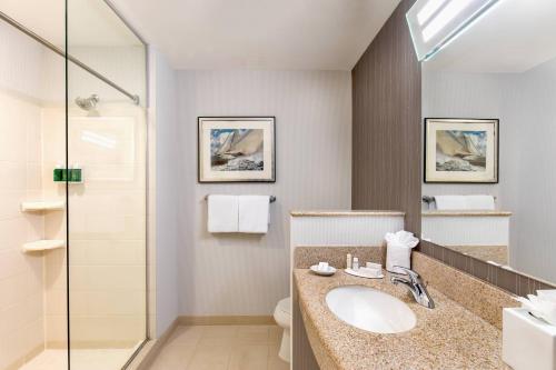 a bathroom with a sink and a shower at Courtyard Boston Copley Square in Boston