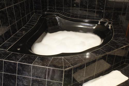 a bath tub filled with snow in a bathroom at Amara Hotel in Lima