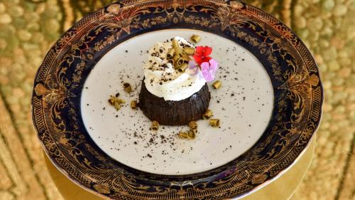a dessert on a plate on a table at The Villa Casa Casuarina in Miami Beach
