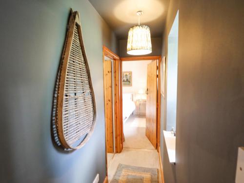 a hallway with a large surfboard hanging on a wall at The Waggon Shed in Nottingham