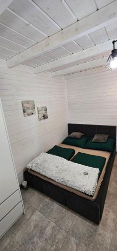 a bedroom with two beds in a room at Apartamenty Carpe Diem in Sława