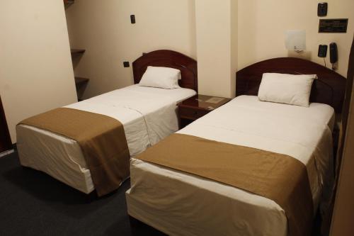 Postel nebo postele na pokoji v ubytování Amara Hotel