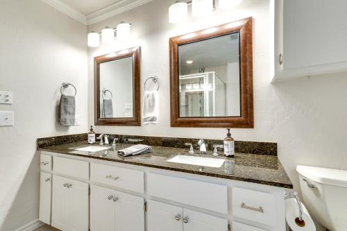 a bathroom with two sinks and a mirror at Norman Vacation Rental Less Than 1 Mi to University! in Norman