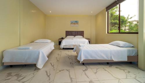 Postel nebo postele na pokoji v ubytování Hotel Sada