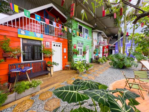 a courtyard of a building with colorful houses at Gió Homestay in Xuan An