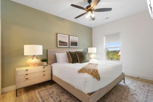 a bedroom with a bed and a ceiling fan at Panoramic Lake Views, Free Silver Dollar City Tickets, Stunning Decor in Kimberling City