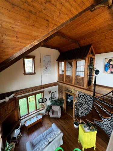 an overhead view of a living room with a wooden ceiling at Chalet Epicea in Sainte-Anne-des-Monts