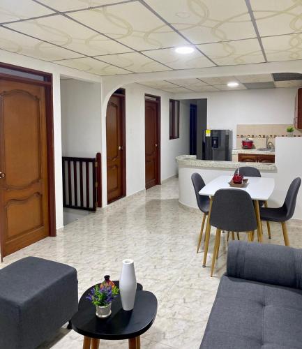 a living room with a couch and a table at Apartamento pinares Santa Rosa in Santa Rosa de Cabal