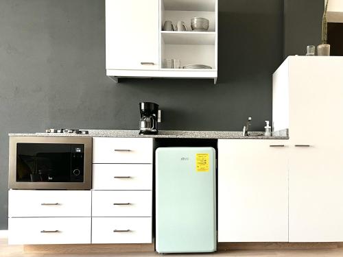 Kuchyň nebo kuchyňský kout v ubytování Bello y luminoso apatamento en el Centro Historico