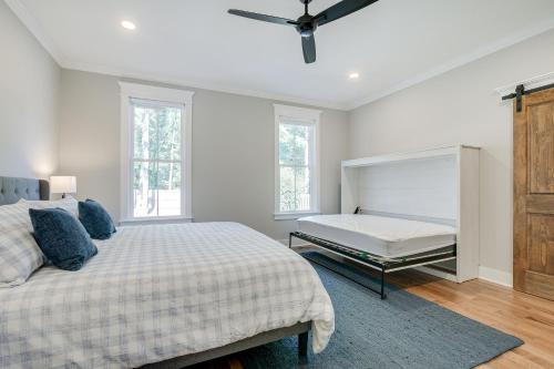 a white bedroom with a bed and a bench at North Carolina Home about 2 Mi to Pinehurst Resort in Pinehurst