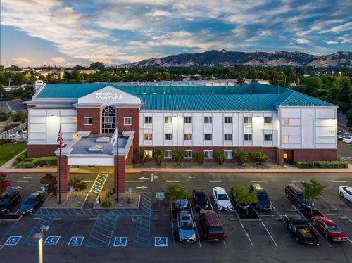 an aerial view of a hotel with a parking lot at Sonesta Essential Vacaville Napa Valley in Vacaville