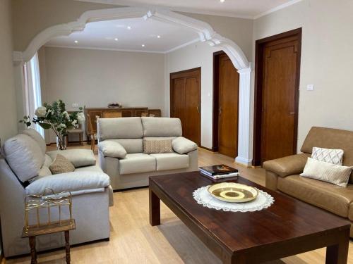 a living room with a couch and a coffee table at Las Mañanitas in Tafalla