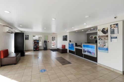 a lobby of a building with a waiting room at Motel 6-Bryan, TX - University Area in Bryan