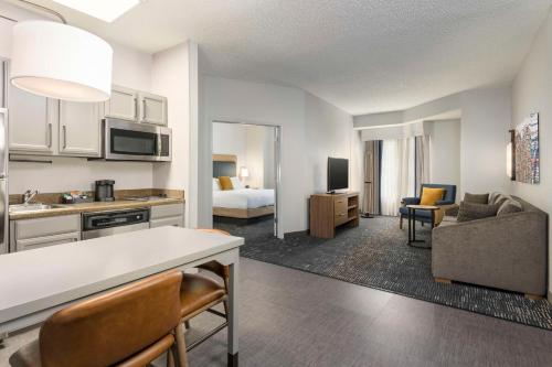a room with a kitchen and a living room at Homewood Suites by Hilton New Orleans in New Orleans