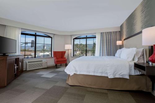 a hotel room with a bed and a television at Hampton Inn Santa Barbara/Goleta in Santa Barbara