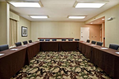 a large room with rows of tables and chairs at Hampton Inn St. Louis - Westport in Maryland Heights