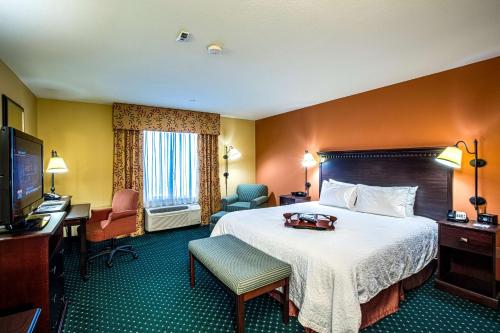 a hotel room with a bed and a desk at Hampton Inn & Suites Sacramento-Elk Grove Laguna I-5 in Elk Grove
