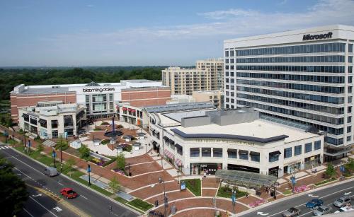 an aerial view of a city with buildings and a street at Embassy Suites by Hilton Washington DC Chevy Chase Pavilion in Washington