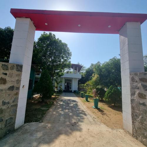 an entrance to a house with a red roof at White Win Villa in Elewala