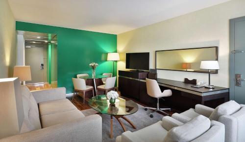 a living room with a couch and a table at Transcorp Hilton Abuja in Abuja