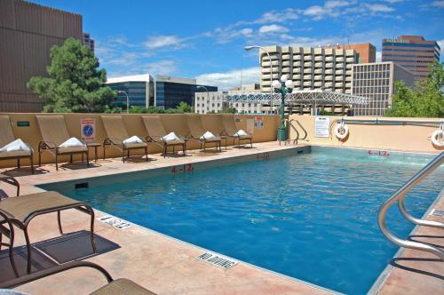 a swimming pool on the rooftop of a hotel at DoubleTree by Hilton Hotel Albuquerque in Albuquerque