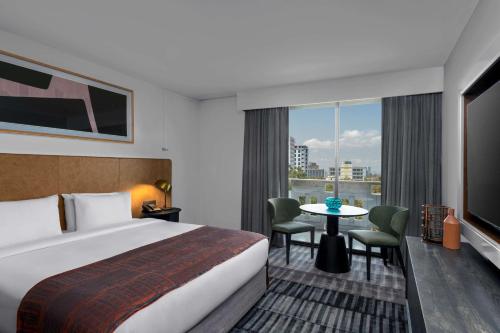 a hotel room with a bed and a table at Hilton Addis Ababa in Addis Ababa