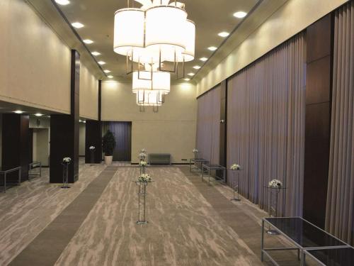 a large lobby with a large chandelier in a building at Ankara HiltonSA in Ankara