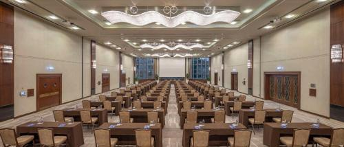 a large room with tables and chairs in it at Ankara HiltonSA in Ankara