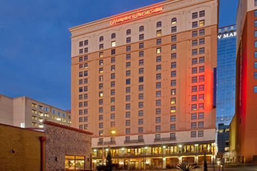 a building with a sign on the side of it at Hampton Inn & Suites Austin - Downtown in Austin