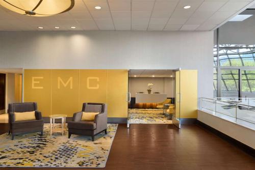 a lobby with two chairs and a waiting room at DoubleTree by Hilton Stamford in Stamford