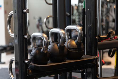 a row of gym balls sitting on a shelf at Hilton Birmingham Metropole Hotel in Bickenhill