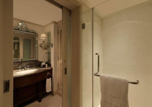 a bathroom with a sink and a mirror at Hilton Mumbai International Airport Hotel in Mumbai