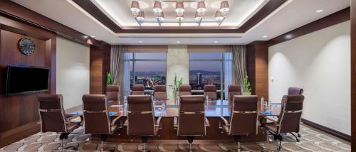 a conference room with a long table and chairs at Hilton Bursa Convention Center & Spa in Bursa