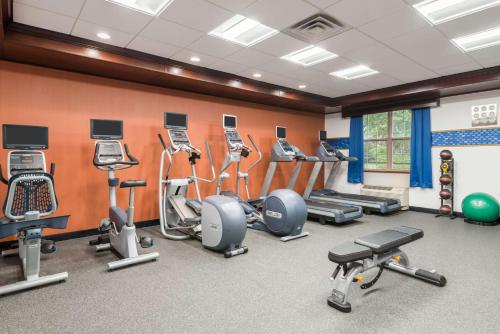a gym with many exercise equipment in a room at Hampton Inn Buffalo-Williamsville in Williamsville