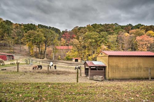 a group of horses in a field with a barn at 5 Mi to Raystown Lake Launch Lucas McCain Cabin in Huntingdon