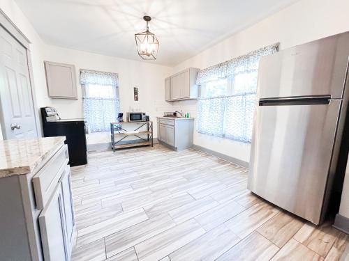 a kitchen with a white refrigerator in a room at Centrally Located 5BR house in Niagara Falls in Niagara Falls