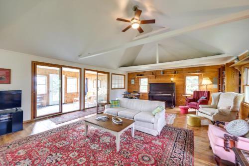 a living room with a couch and a tv at Shorefront House with Views, 14 Mi to Acadia NP in Sullivan
