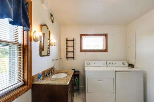a bathroom with a washing machine and a sink at Shorefront House with Views, 14 Mi to Acadia NP in Sullivan