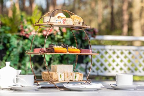 a tray of bread and pastries on a table at Hilton Cobham in Cobham