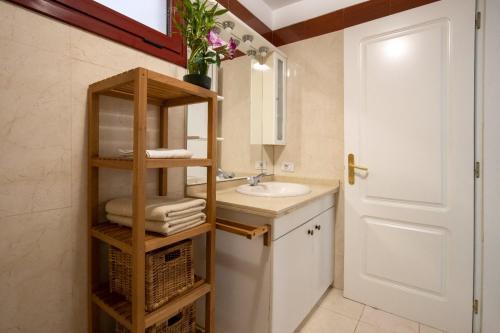 a bathroom with a sink and a towel rack at Apartamento Balandros in Palm-mar