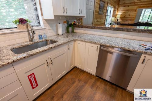 a kitchen with a sink and a dishwasher at 3BR Condo with Lake View - Trout Fishing - Playground - 2 Pools - Stairs Required - FREE TICKETS INCLUDED - PR69-9 in Branson