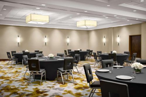 a conference room with tables and chairs in it at Hilton Garden Inn Dallas Richardson in Richardson
