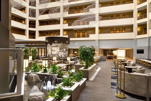 a rendering of the lobby of a hotel at Embassy Suites Dallas - DFW Airport North in Grapevine